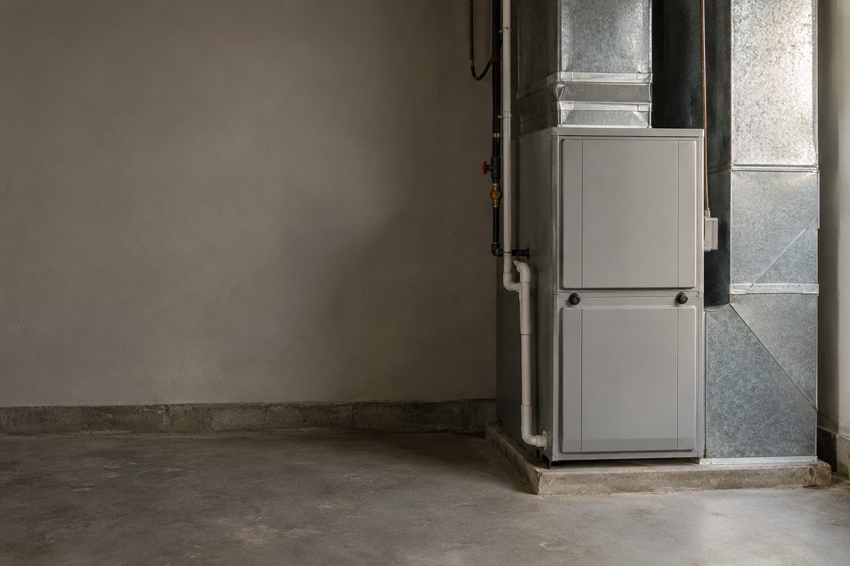Closed residential heating cabinet and ductwork in a utility space
